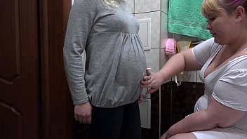 A Busty Nurse Administers A Creamy Enema To A Pregnant Milf’s Hairy Cunt, Fingering Her Pussy Until She Unexpectedly Cums Hard In This Fetish Lesbian Scene.
