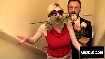 A Sultry Blonde Temptress Teases With A Rose Between Her Lips And A Blindfold Veiling Her Lustful Gaze.