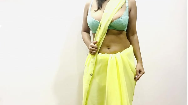 Voluptuous Indian Bhabhi Teases In A Dazzling Yellow Saree