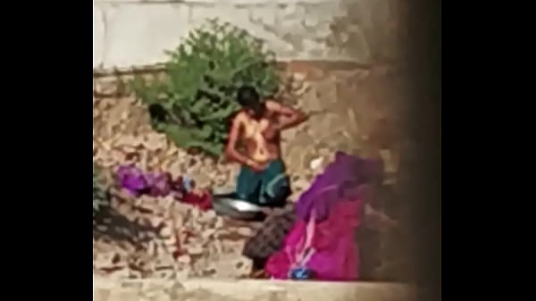 Naked Indian Babe Bathing In The Open