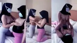 Lesbian Hijab Duo Sensually Caressing Each Other’s Breasts