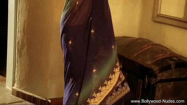 Bollywood Babe Flashes A Teasing Smile, Curves Ready To Please.